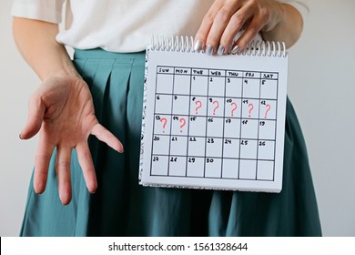 Missed period and marking on calendar. Unwanted pregnancy, woman's health and delay in menstruation. Period late
