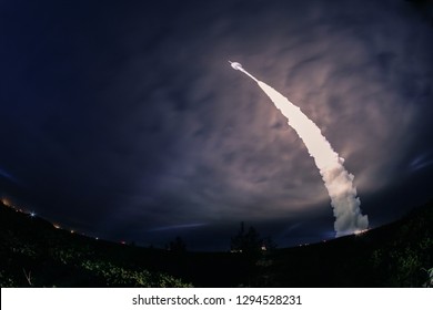 Missile Launch At Night. The Elements Of This Image Furnished By NASA.