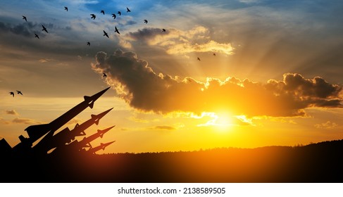 The missiles are aimed at the sky at sunset. Nuclear bomb, chemical weapons, missile defense, a system of salvo fire.