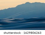 Missiles being launched during a test in White Sands National Park near Alamogordo, New Mexico at sunset.