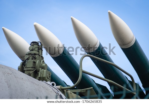 Missiles ready to launch, weapons of mass\
destruction, preparation for war and fight against terrorism\
against the blue of the peaceful\
sky.
