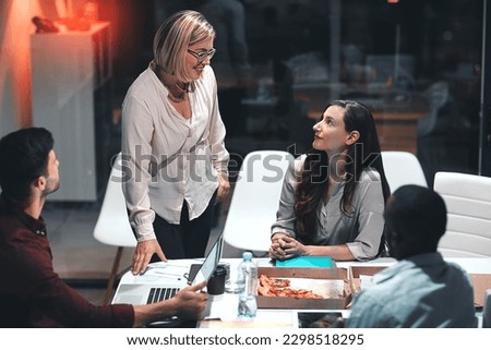 Missing a deadline Not on their watch. colleagues having a meeting during a late night in a modern office.