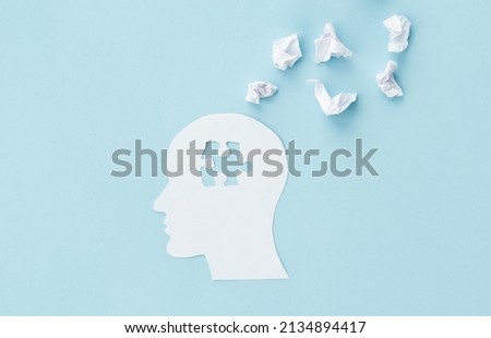 missing jigsaw puzzle of human brain on blue background. Creative idea for solving problem. Mental health care.
