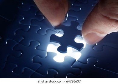 Missing jigsaw puzzle piece with light glow, business concept for completing the final puzzle piece - Shutterstock ID 64728637