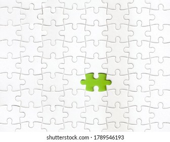 Missing piece of puzzle with a green color as background