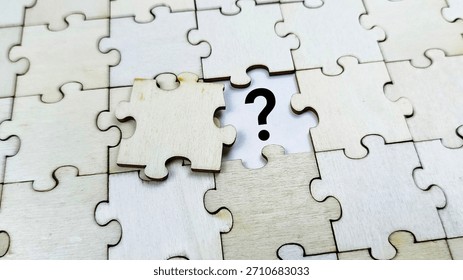 Missing puzzle piece with question mark, representing problem solving, business challenges, uncertainty, knowledge gap, and search for solutions. 