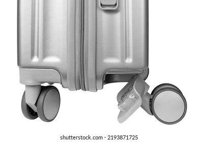 A missing wheel on a travel suitcase. Broken suitcase. Broken suitcase isolated on white background. - Shutterstock ID 2193871725