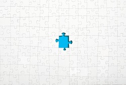 Missing White Jigsaw Puzzle Pieces On Blue Background Copy Space For Your Text. Business Concept. 