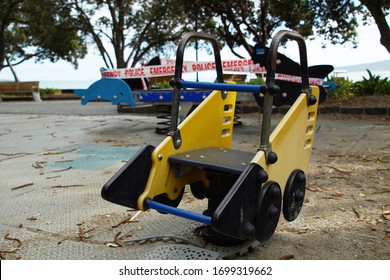 Mission Bay, Auckland / New Zealand - March 27 2020: Police Emergency Red And White Warning Tape On Children's Outdoor Playground Equipment To Prevent Use During The Coronavirus Lockdown.
