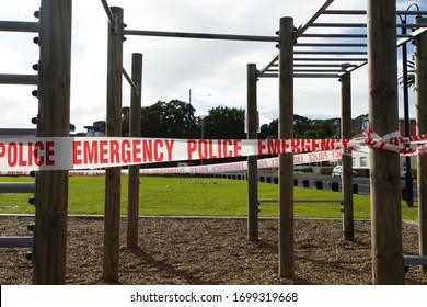 Mission Bay, Auckland / New Zealand - March 27 2020: Red And White Police Emergency Warnin Tape On Outdoor Jungle Gym Playground Equipment Preventing Use During The Coronavirus Lockdown.  Crime Scene.