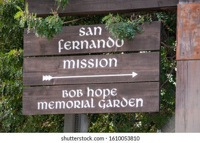 Mission Hills, California / USA -  January 7, 2020: San Fernando Mission And Bob Hope Gardens Sign At The Historical Spanish Mission San Fernando Rey De España.