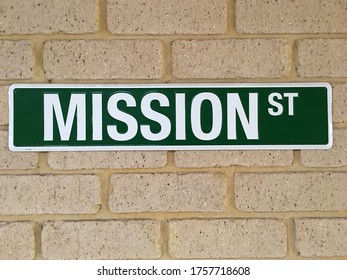 Mission Street Sign On A Brick Wall Background And Texture.