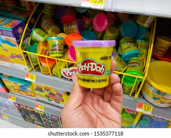 Mission Viejo, California/United States - 09/19/2019: A Hand Holds A Container Of Play-Doh, Or Play Doh, At A Local Department Store, In The Toy Section.