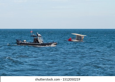 Mississagua, Ontario, Canada - Sep 22,19: Peel Police Boat Arrives At The Catamaran Boat Accident Scene As It Fell Down During Strong Wind At Lake Ontario. Essential Services Workers.