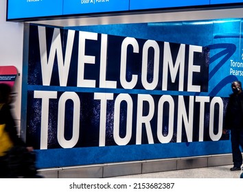 Mississauga, Canada, April 19, 2022; A large Welcome to Toronto sign greeting passengers in the luggage area at YYZ Pearson International Airport