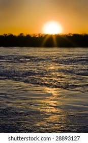 Mississippi River At Flood Stage With Setting Sun