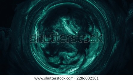 Mist circle. Round frame. Mystic vortex. Green blue color glowing sparkling glitter particles in smoke swirl on dark black abstract background.