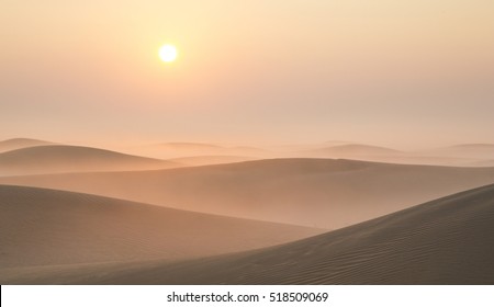 Mist in a desert at sunrise near Dubai, UAE