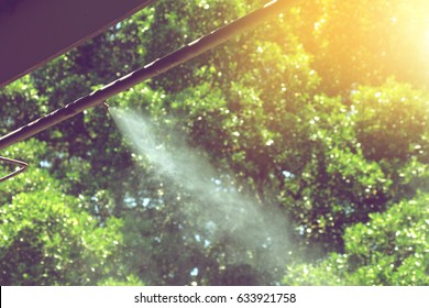 Mist Nozzle Water Spraying System On A Hot Summer Day In Thailand