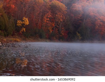 The Mist Reflecting In The Grand River, Shot In Autumn, In Kitchener, Ontario, Canada.