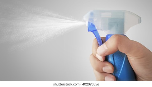 The Mist Of A Spray Bottle Spraying Water Into The Air.