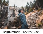 Mist Trail Vernal Fall Hiker Outdoor Backpacker Man on the trail photographer nature adventurer mist trail waterfall mountains forest trees rocks