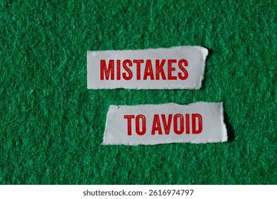 Mistakes to avoid message written on ripped torn paper pieces on green background. Conceptual mistakes to avoid symbol. Copy space.