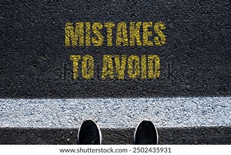 Mistakes to avoid message written on asphalt road. Conceptual mistakes to avoid symbol. Copy space.