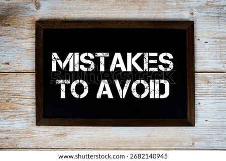 Mistakes To Avoid text with gift box present and alarm clock on black background