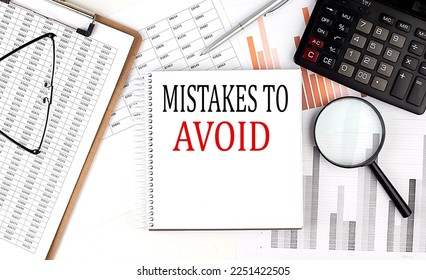 MISTAKES TO AVOID text on notebook with clipboard and calculator on chart background