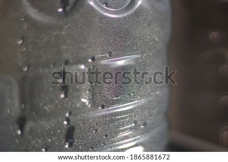 Misted bottle eraser. The surface is covered with small droplets from the inside. Condensation inside the container due to hot weather.