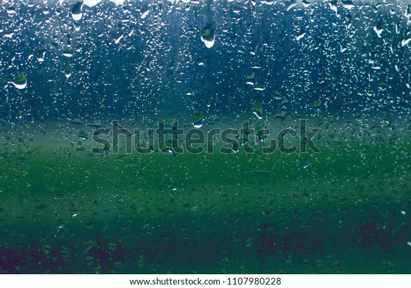 misted glass. Water on the car glass. beautiful\
desktop, blue, background.\
Textures.