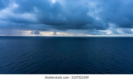 Mistic Wide View Over The Horizon Open Sea With Dramatic Cloudy Sky. 