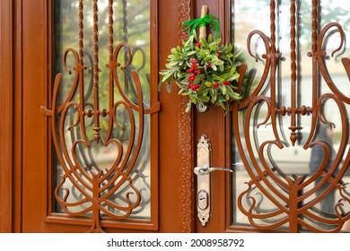 Mistletoe Branch On Wooden Door, Outdoors