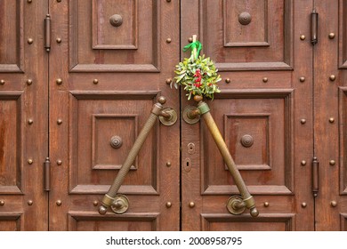 Mistletoe Branch On Wooden Door, Outdoors