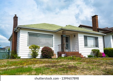 Mistreated Yard Lawn In Front Of Modest Residential House