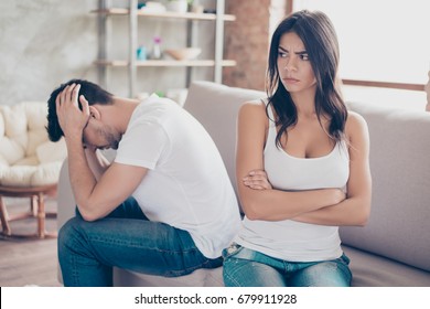 Mistrust And Cheat Problems. Annoyed Couple Is Ignoring Each Other, Sitting On The Couch Upset Indoors At Home. I Am Not Talking To You!