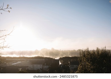 Mist-shrouded sunrise over a suburban landscape - Powered by Shutterstock