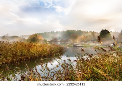 Misty autumn sunrise at Dilham canal on the River Ant in North Walsham in Norfolk - Powered by Shutterstock