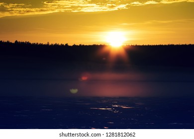 Misty Calm Evening On The Forest Lake Is Illuminated By The Colors Of Sunset, Melting Ice, Reflection In The Water Mirror. Spring In The Arctic North. Scandinavia, Lapland