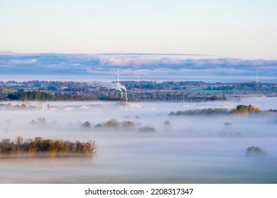 Misty Countryside View With Smoke From Chimney