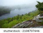 Misty fog rolling over Lake Solitude on Mt. Sunapee in Newbury, New Hampshire in springtime.