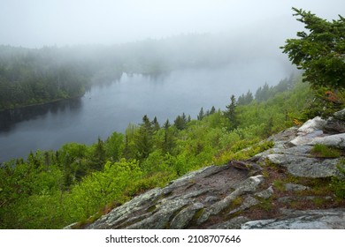 Misty Fog Rolling Over Lake Solitude On Mt. Sunapee In Newbury, New Hampshire In Springtime.