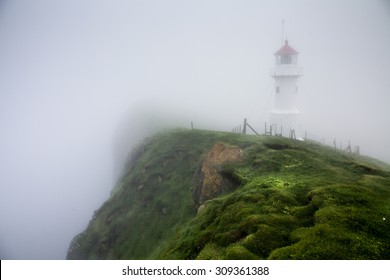 Misty Lighthouse. Lighthouse On Mykines Island, Faroe Islands, Denmark