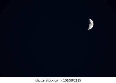 misty moon in its first quarter or late in its last quarter. Crescent moon. early moon Background. planetar satellite in Solar System. lunar phase. Sun illuminated Half Moon were NOT furnished by NASA