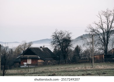 Misty morning in mountain village in springtime - Powered by Shutterstock