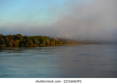 A Misty Morning On The Rainforest-lined Guaporé-Itenez River, Near Ilha Das Flores, Rolim De Moura Do Guaporé, Rondonia, On The Border With Beni Department, Bolivia