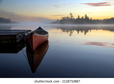 Misty Morning And A Red Canoe