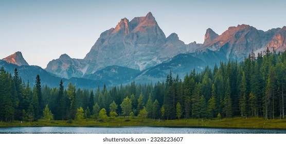 Misty morning scene of  forest lake in highland with rocky peak. High resolution. - Powered by Shutterstock