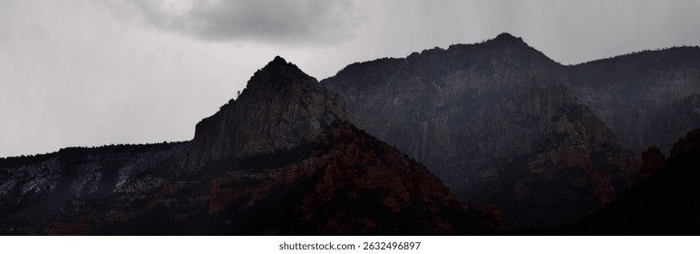 Misty Mountain Range with a Cloudy Sky